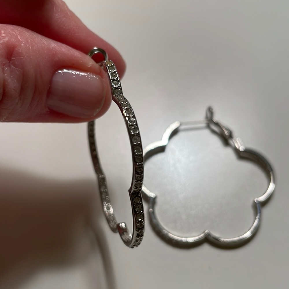 Silver and crystal earrings. Inside/ out crystal placemat. About 2” diameter.